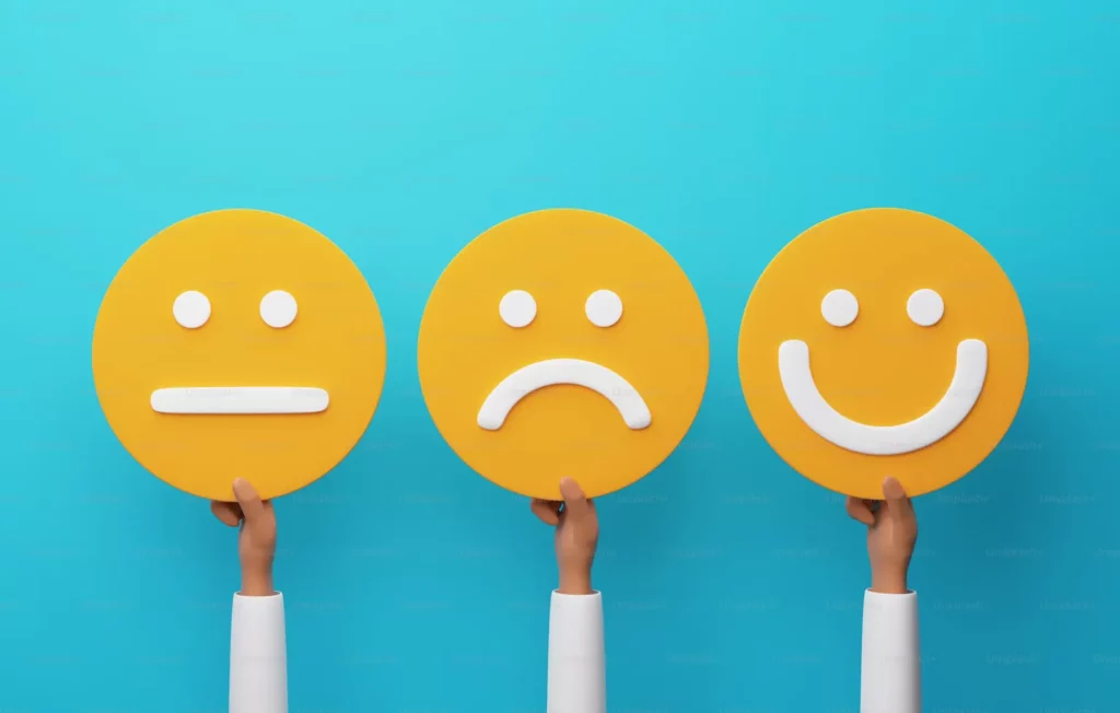 Three emojis showing happiness, sad, and hardly satisfied