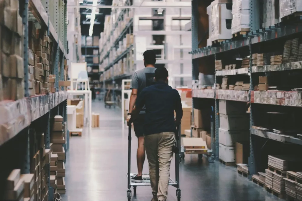 Two people working in a warehouse