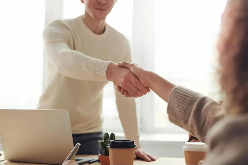 Client and Company sealing a deal through handshake