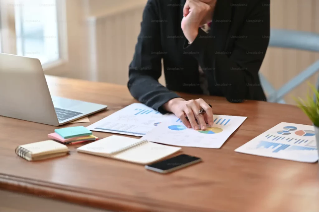 Man working on charts and bar graphs