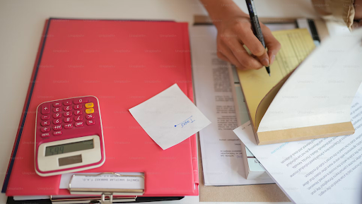 Cluttered paperwork and data collection, representing manual claims processing challenges.