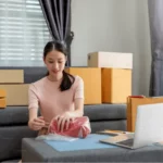 A woman opening her ordered packages