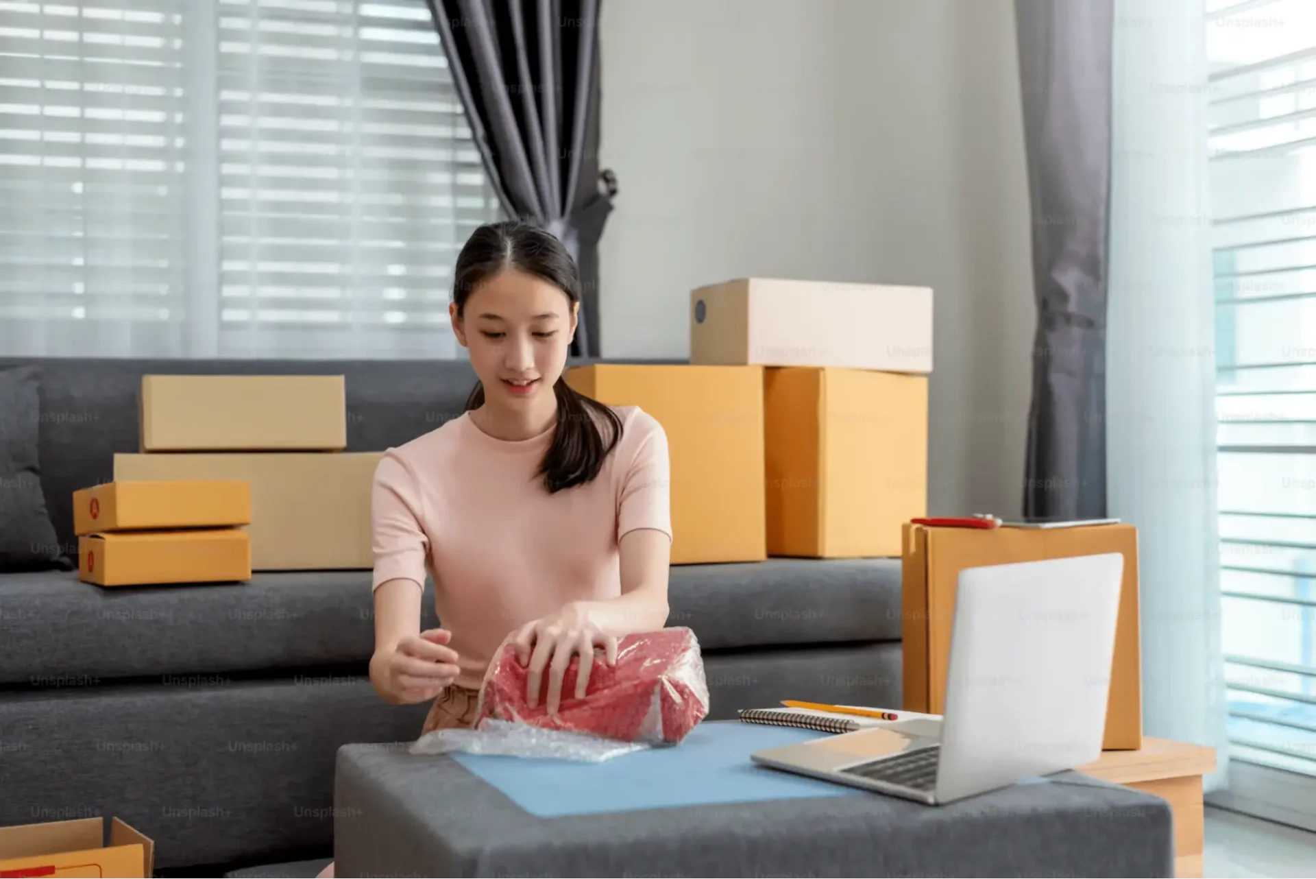 A woman opening her ordered packages