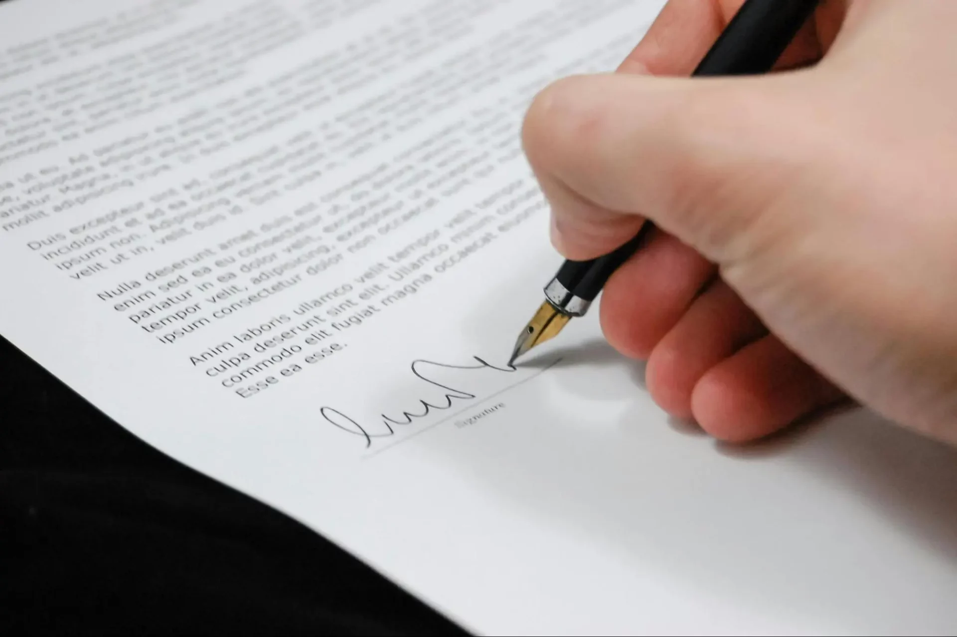 Person signing in a document