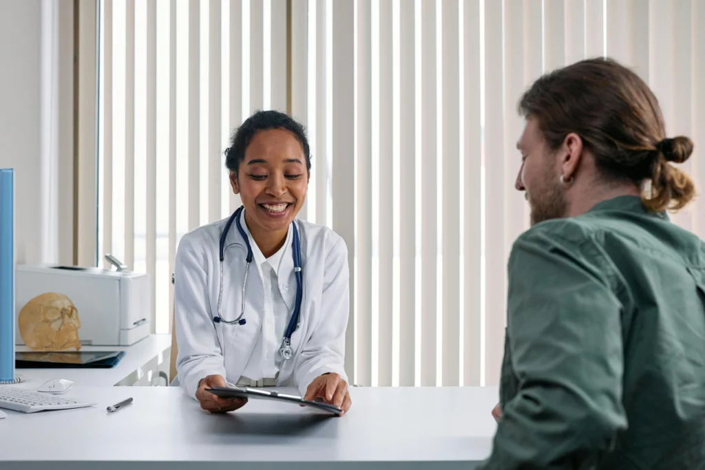 Doctor prescribing medicines to patient