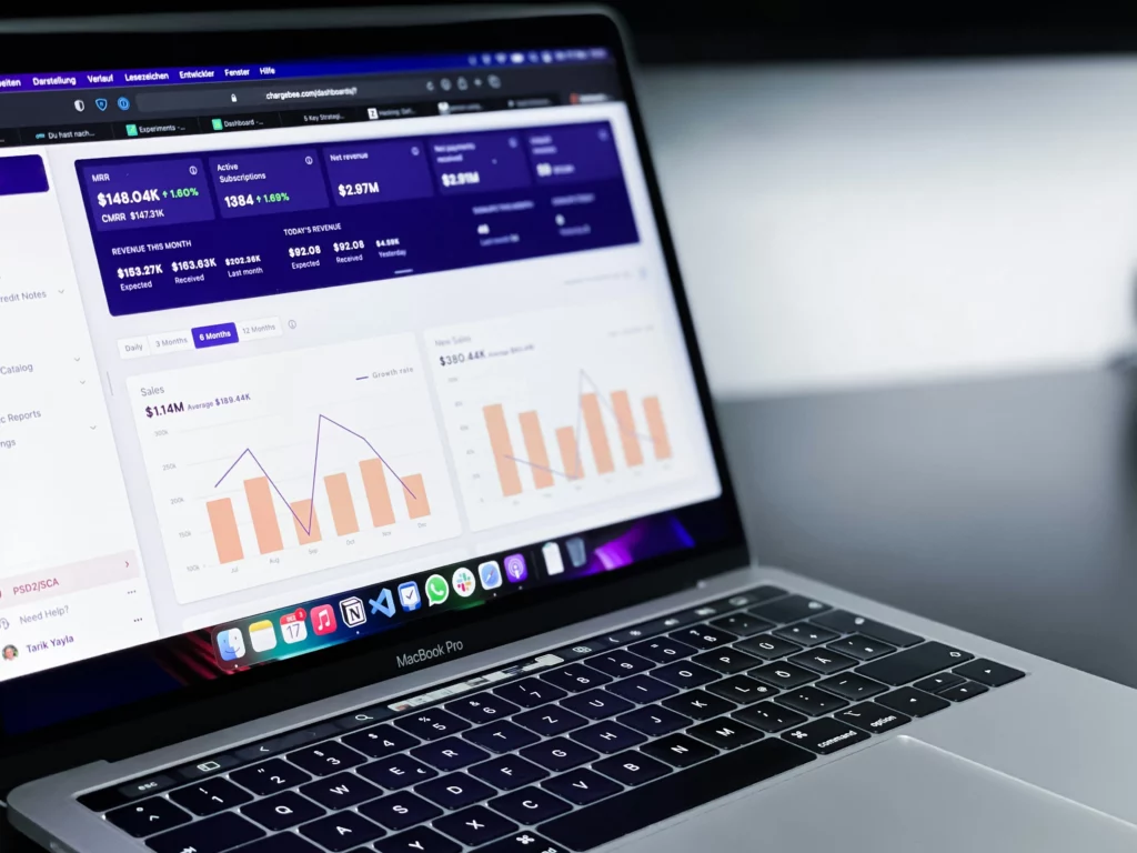 laptop screen showing various metrics and dashboard