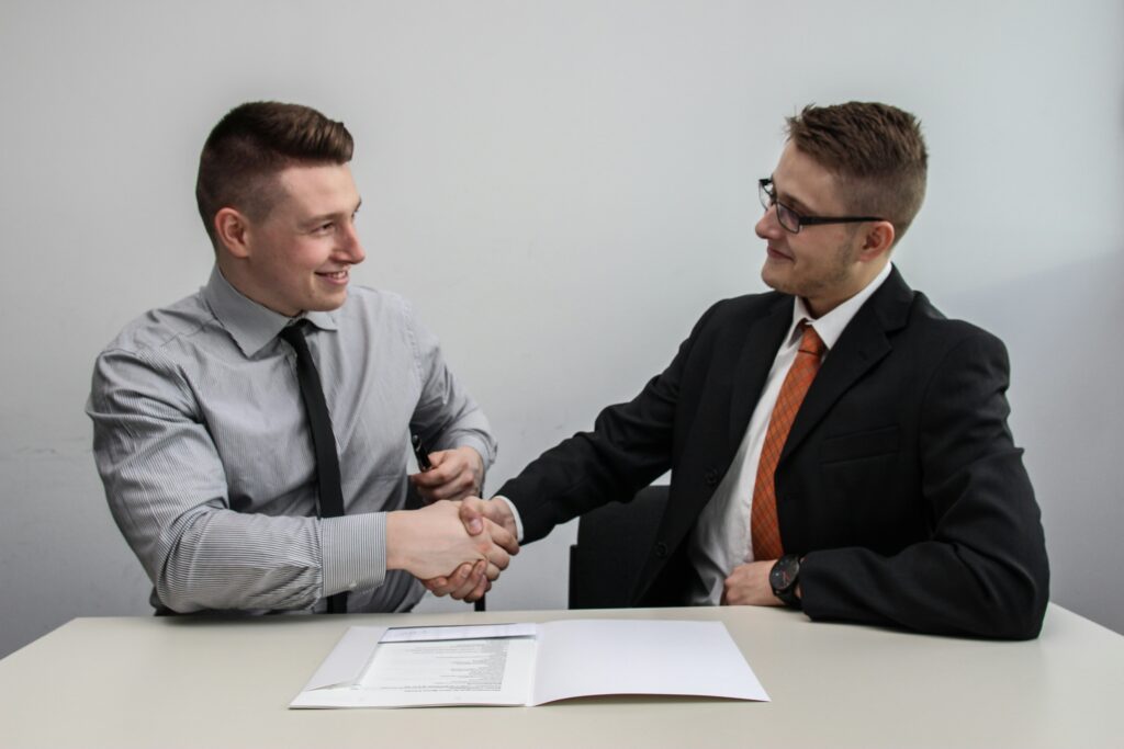 Men shaking hands with each other