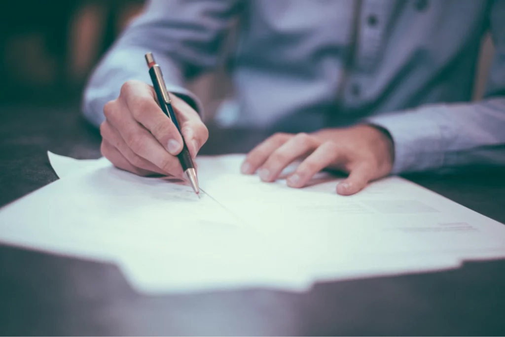 Man signing on a document