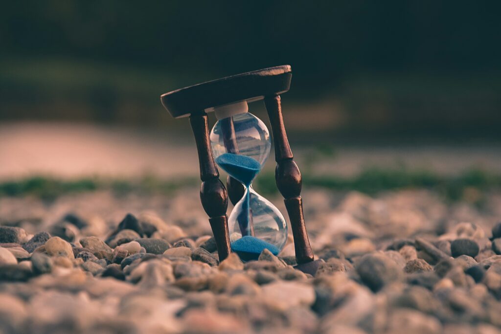 Sand clock is kept on stones